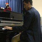 teacher playing piano